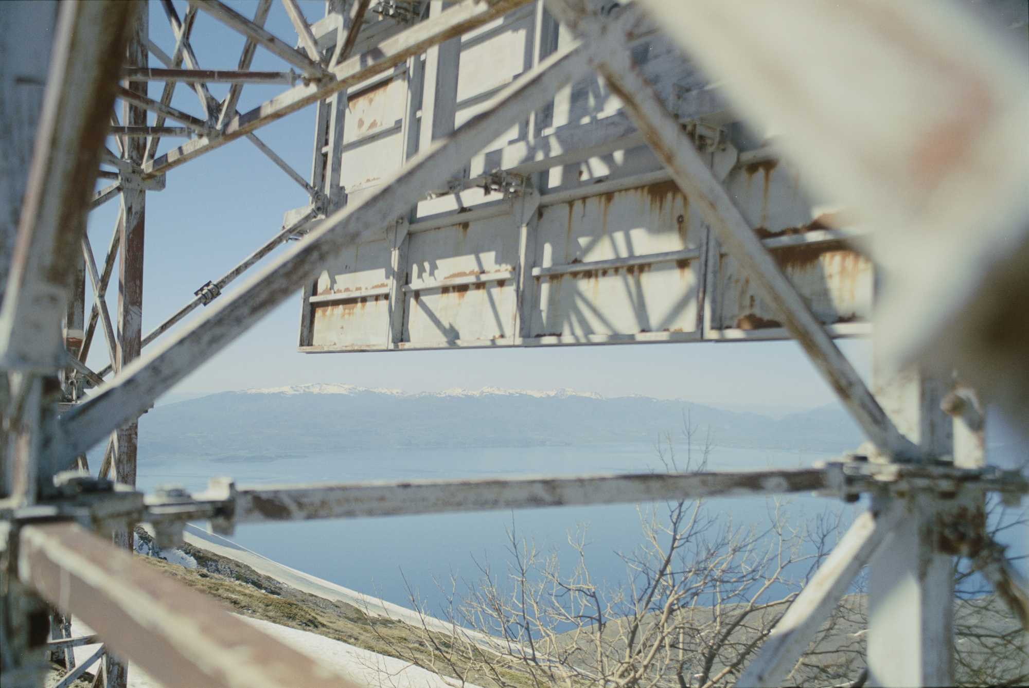 View of mountains through a big sovjet propaganda sign